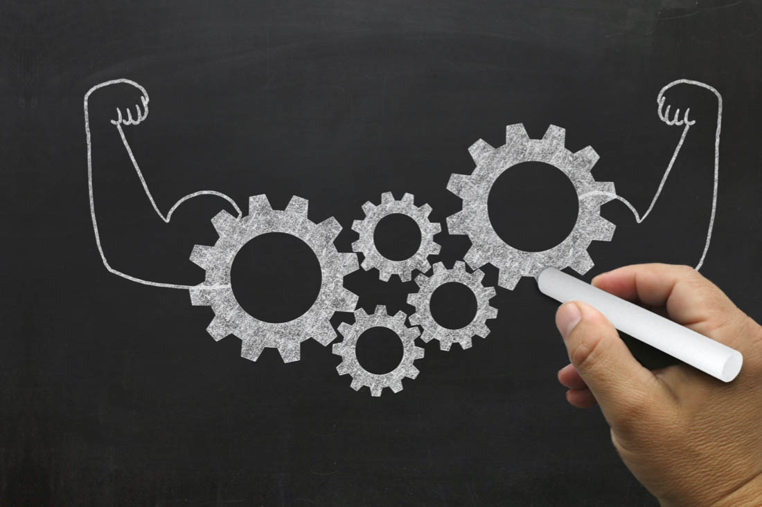 Gears with arms flexing to symbolize team productivity tools working together to achieve business goals.