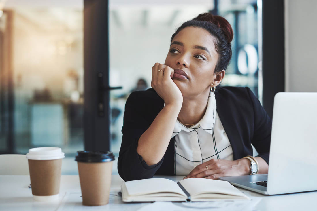 Employee disengagement pictured as an employee looking off into the distance.