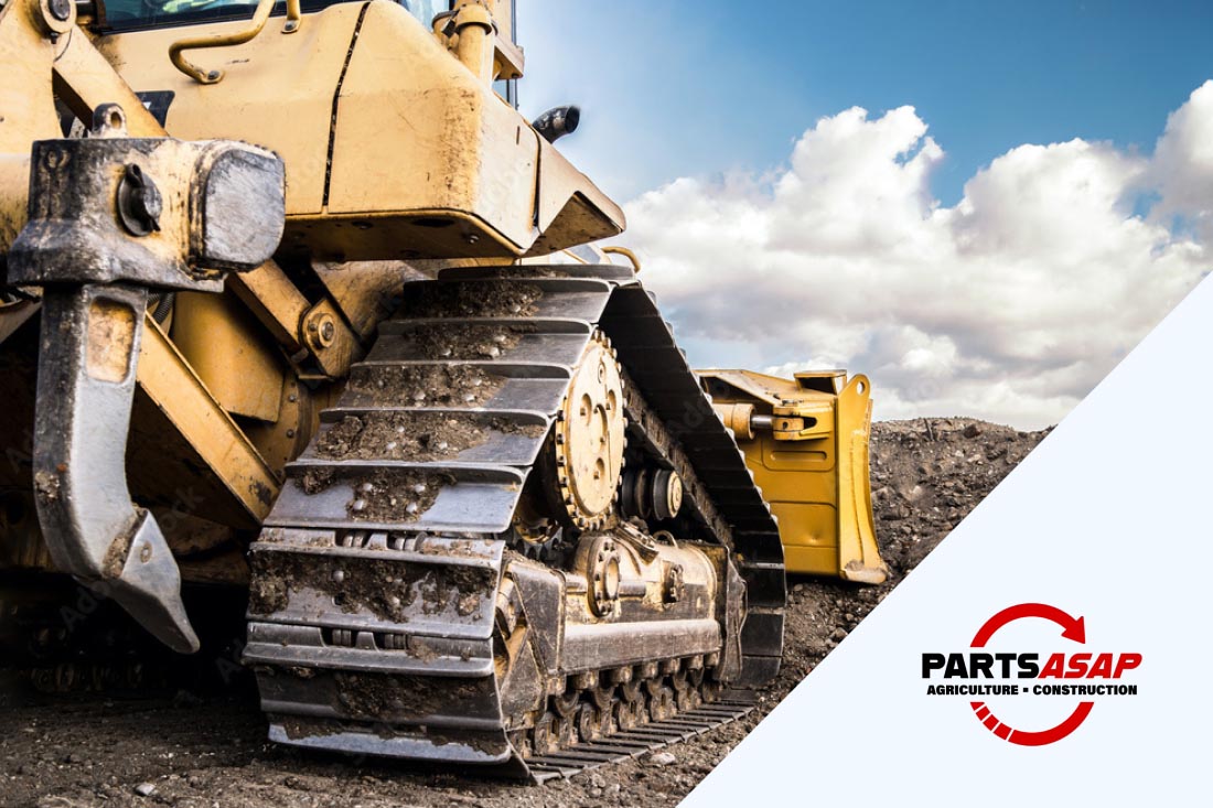 Image with Bulldozer with steel tracks at a construction site and Parts ASAP logo.