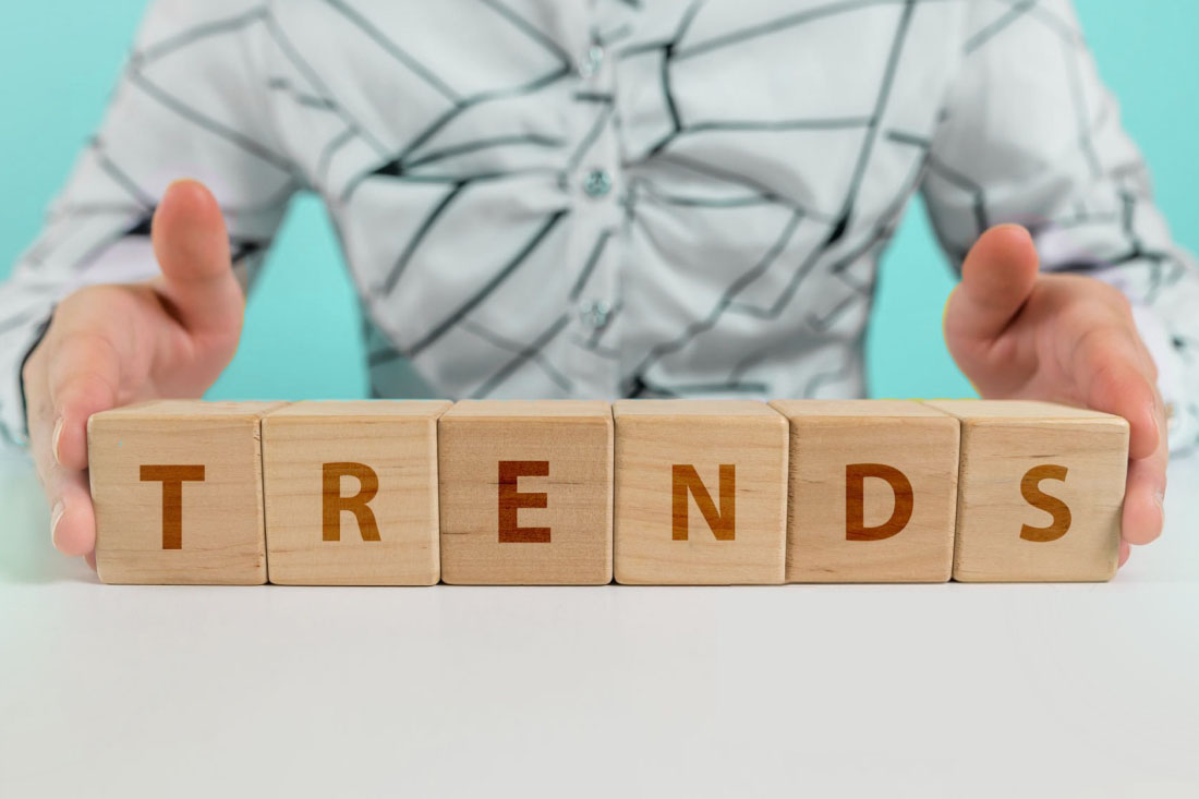 Wooden blocks on a table that spell “trends".