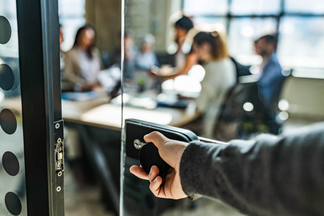 An employee opening the to in their return to office for the first time.
